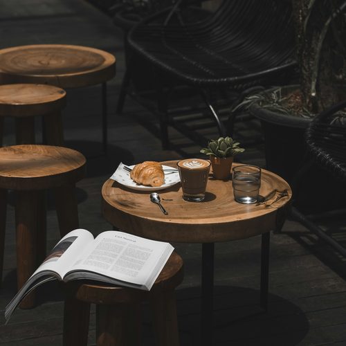 Coffee and a croissant on a cafe table